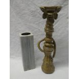 An unusual Studio pottery candlestick with face decoration,