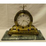 A good quality 19th Century French mantel clock with enamelled circular dial in brass arched case