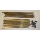 Two sets of brass stair rods with clips