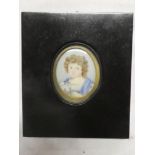 A 19th Century miniature watercolour on ivory depicting a bust portrait of a young girl "Amelia