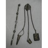 A Continental silver plated chatelaine with scroll decoration and one other silvered chain (2)