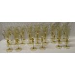 A suite of Venetian wine glasses comprising eight large tinted wine glasses with tapered stems and