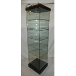 A good quality glass freestanding mobile square section display cabinet with shelves, LED lighting,