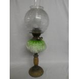 An Edwardian brass oil lamp with alabaster mounted stem,