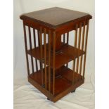 A good quality reproduction inlaid walnut Victorian-style square revolving bookcase