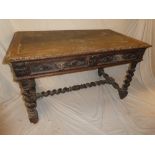 A Victorian carved oak rectangular writing table with inset leather writing surface,