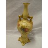 A Royal Worcester china tapered two handled spill vase with painted floral decoration on blush