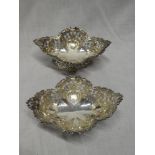 A pair of late Victorian silver bon-bon dishes with pierced and raised decoration, 5½" long,