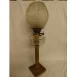 A Victorian brass oil lamp with fluted column,
