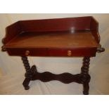 A Victorian stained pine wash stand with two drawers in the frieze on turned supports with plateau
