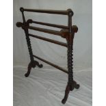 A Victorian mahogany towel rail with spiral turned supports