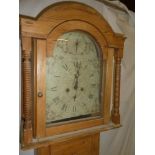 A 19th Century longcase clock with 12" painted arched dial and 8-day movement in polished pine