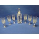 A set of six cut glass wine goblets by Thomas Webb and a heavy glass square shaped decanter and