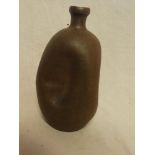 An old terracotta tapered spill vase with compressed sides,