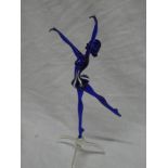 An ornate coloured glass figure of a ballerina,