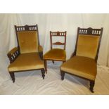 A Victorian carved walnut parlour suite comprising six dining chairs with rail backs and