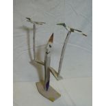 A painted wood character figure with two birds by Bryan Illsley, signed and marked "HV 1981",