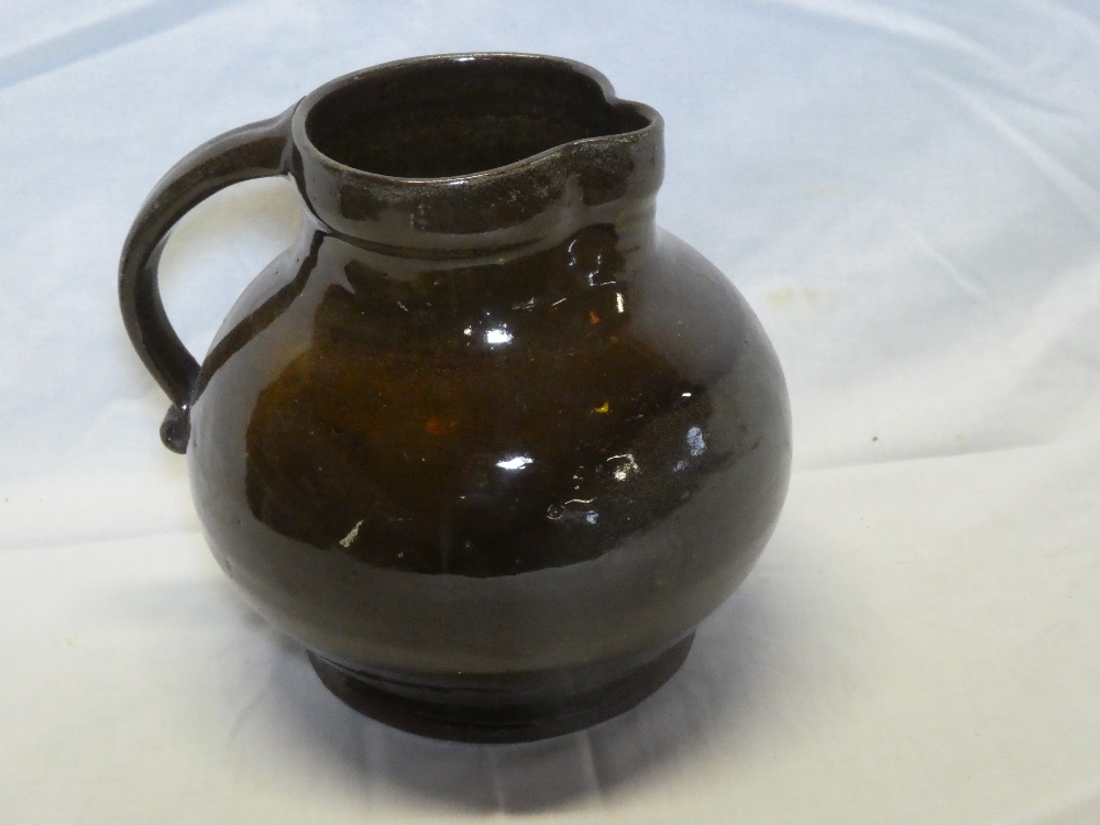 A Lakes Cornish Truro Pottery brown glazed terracotta jug,