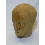 An unusual rustic wooden sculpture of a male head, signed "HB",