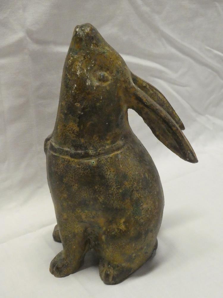 An unusual bronzed metal figure of a seated rabbit,