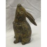 An unusual bronzed metal figure of a seated rabbit,