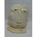 A ceramic sculpture of a head by Julian Dyson, insized signature and dated 09.