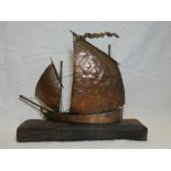 A copper model of a Newlyn fishing lugger by Mark Penrose,