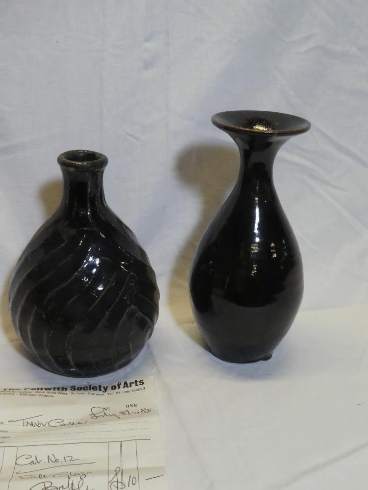 A black glazed Studio pottery baluster-shaped vase, unmarked,