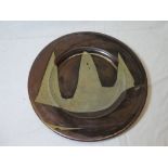 A Winchcombe Studio pottery circular plate with grey and brown decoration by Ray Finch,