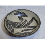 A Studio pottery circular bowl with silver and cream deer decoration, signed MW,