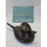 A carved wood figure of a ruddy duck, signed Guy Taplin, 13" long,