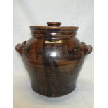 A St Agnes Studio pottery two-handled jar and cover with brown and black glazed decoration,