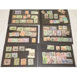 Six stock cards containing a selection of mint and used stamps - Papua New Guinea,