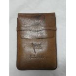 A German Nazi related leather wallet/cigar case with eagle and swastika markings and maritime flag