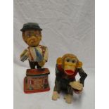 A battery operated Charlie Weaver bartender figure and a battery operated monkey with dice figure