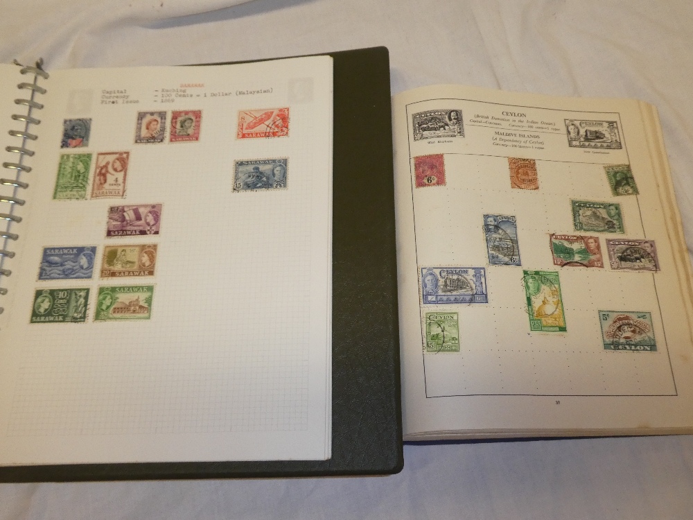 Two folder albums containing World stamps