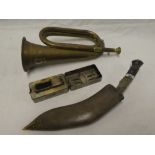 A brass bugle with silvered "5" emblem,