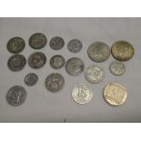 A selection of mixed silver coins including 1840 shilling, 1939 florin, 1920 shilling and others,