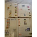 A comprehensive collection of German Democratic Republic East Germany stamps in three matching