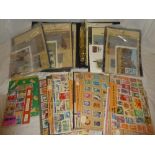 An album in slip case containing World Wildlife Fund packs of animal stamps and cards and a