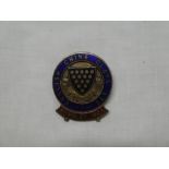 An English China Clays Limited Wembley 1924 enamelled lapel badge