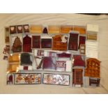 A box containing a selection of modern doll's house furniture,