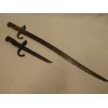 A 19th Century French Chassepot bayonet with curved single edged blade and a French Gras bayonet