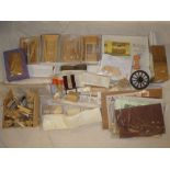 A box containing various modern doll's house fittings including wooden doors, windows, architraves,