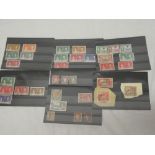 Various stock cards of stamps including 1937 Coronation commemorative stamps,