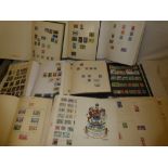 Fourteen folder albums containing a selection of British Commonwealth stamps