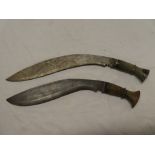 Two old Gurkha kukris with curved single edged blades and horn hilts