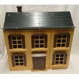 A good quality dolls house with opening front and hinged roof