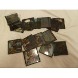 A selection of coloured magic lantern slide plates including nine Peter Pan views,