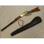 A replica Winchester rifle with polished wood stock